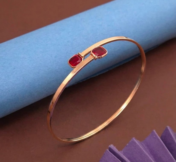 Elegant Gold-Plated Open Cuff Bangle with Twin Ruby Red Gemstones