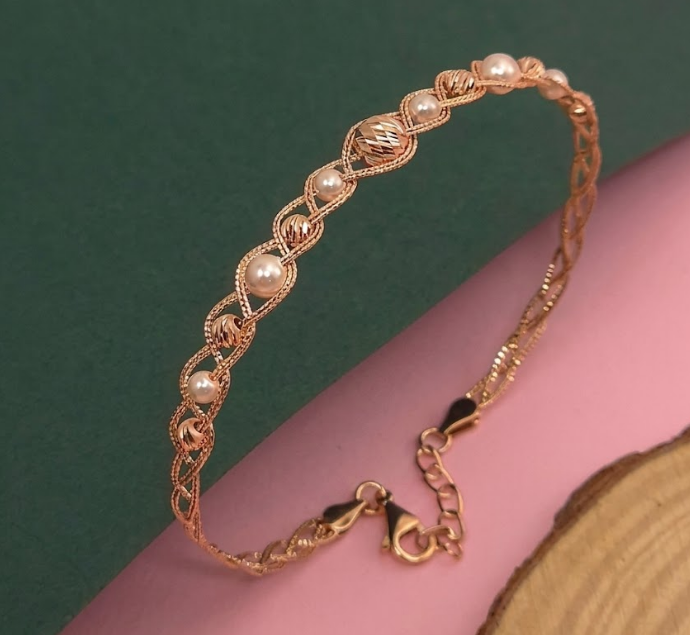 Elegant Pearl & Gold Twist Bracelet